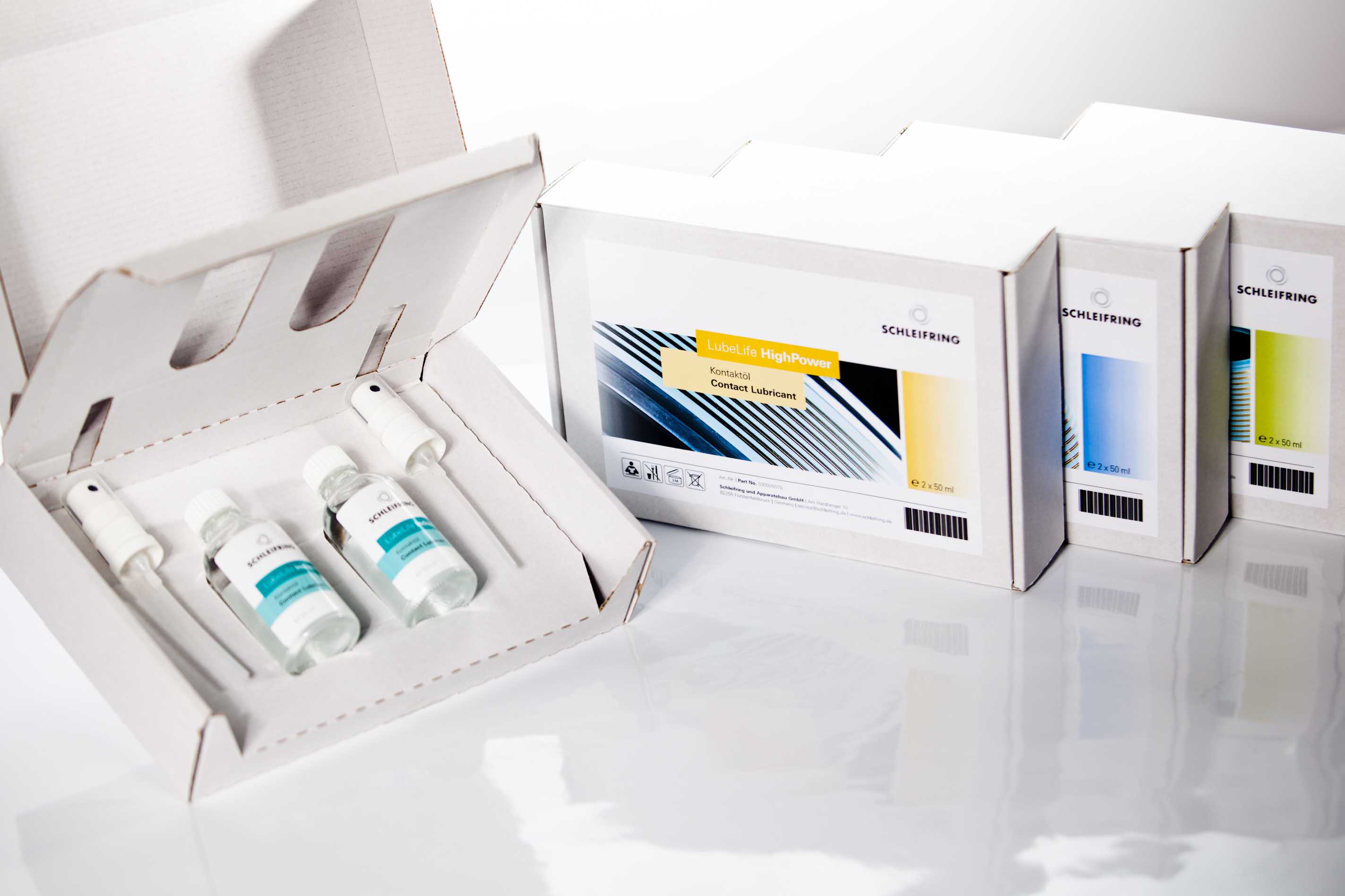 LubeLife Wartungsöle von SCHLEIFRING in Fläschchen mit Applikatoren und Produktverpackungen.